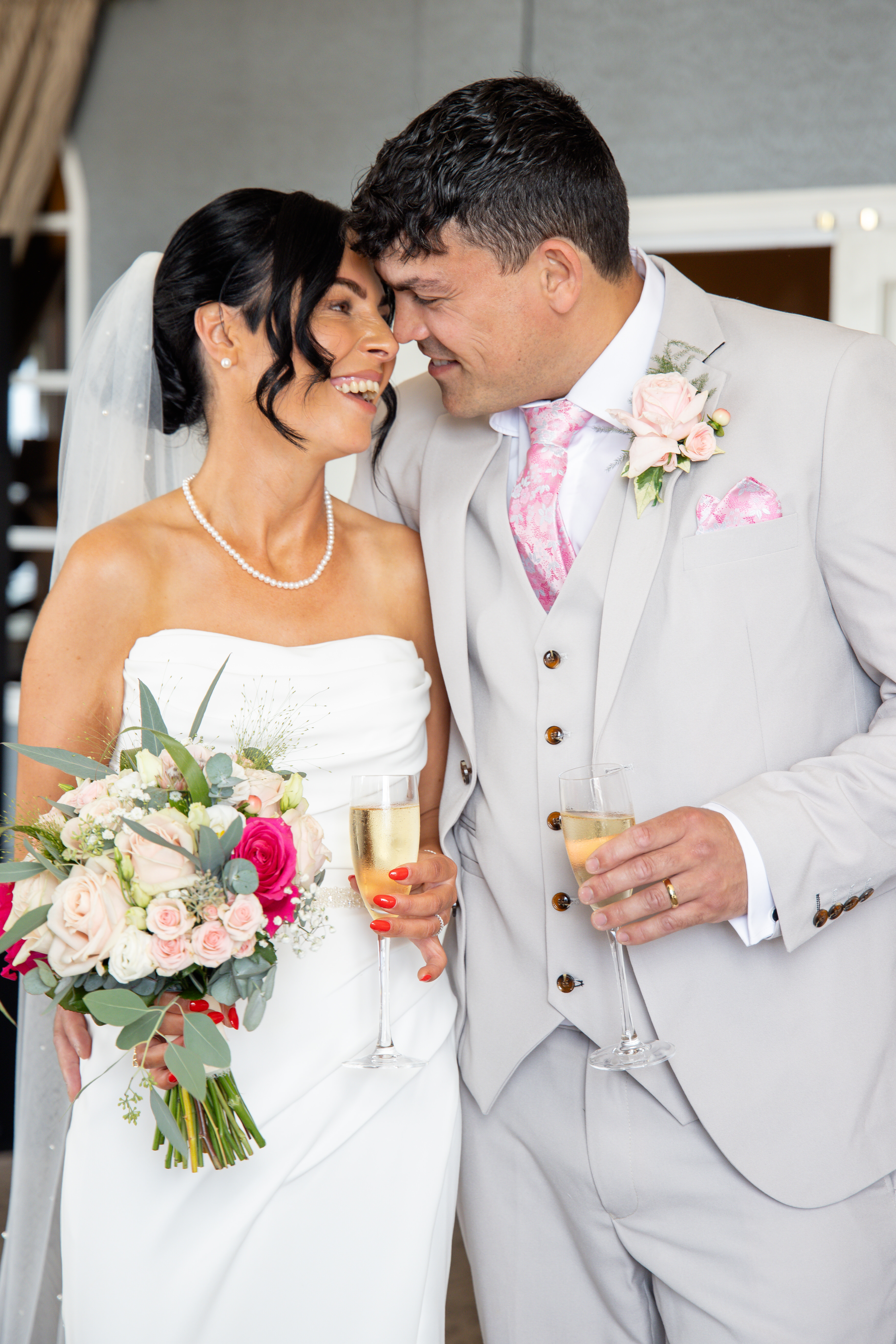 The happy couple enjoy a glass of Champagne 