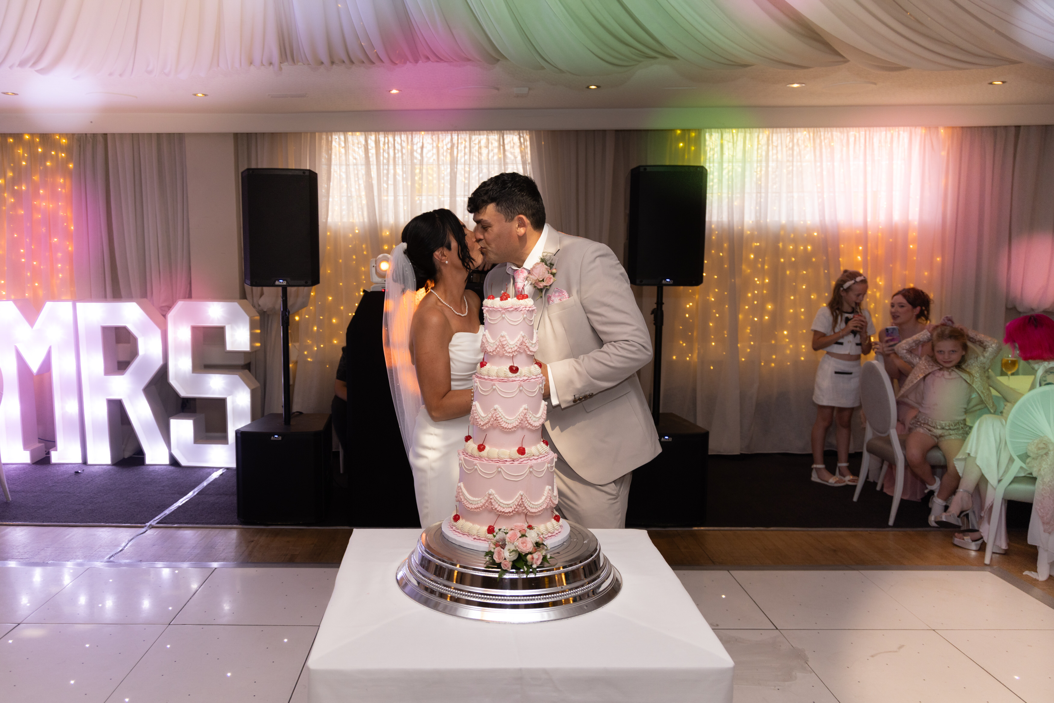 Sarah and Andrew cut their wedding cake 
