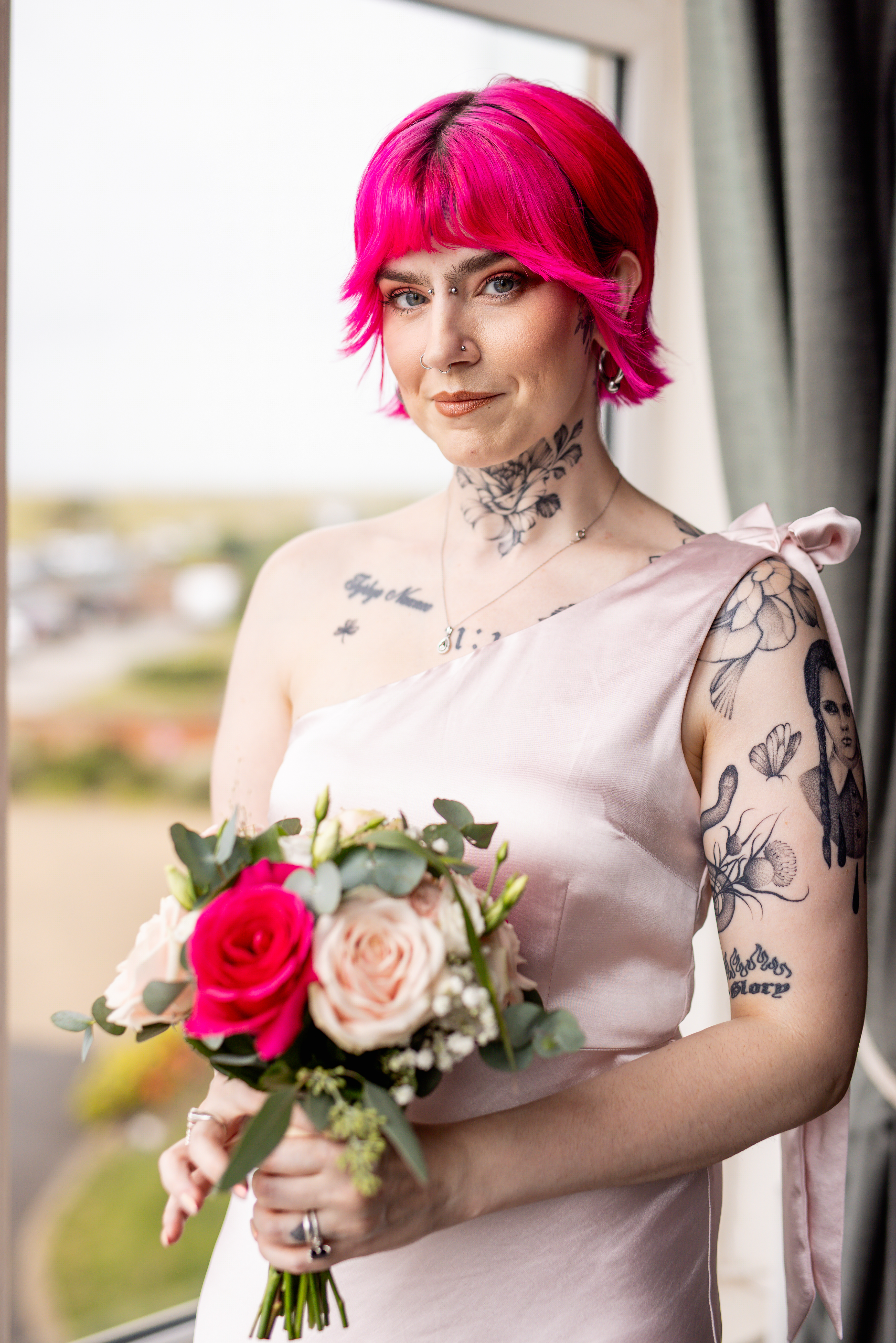 The Bride maid standing with her flowers