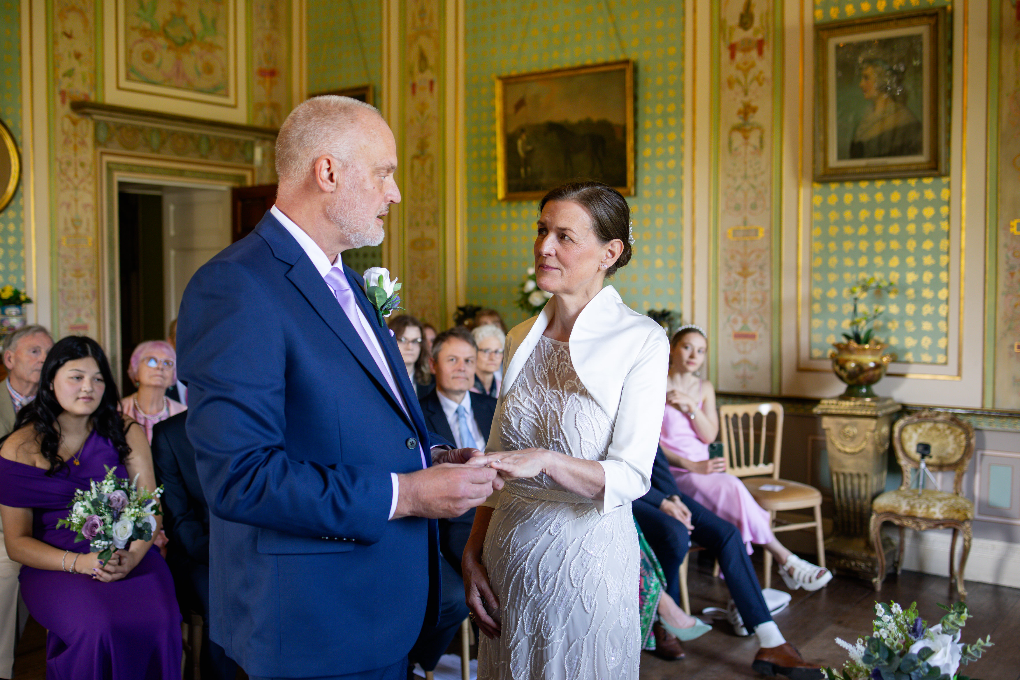 Michael puts Helen's ring on her finger 