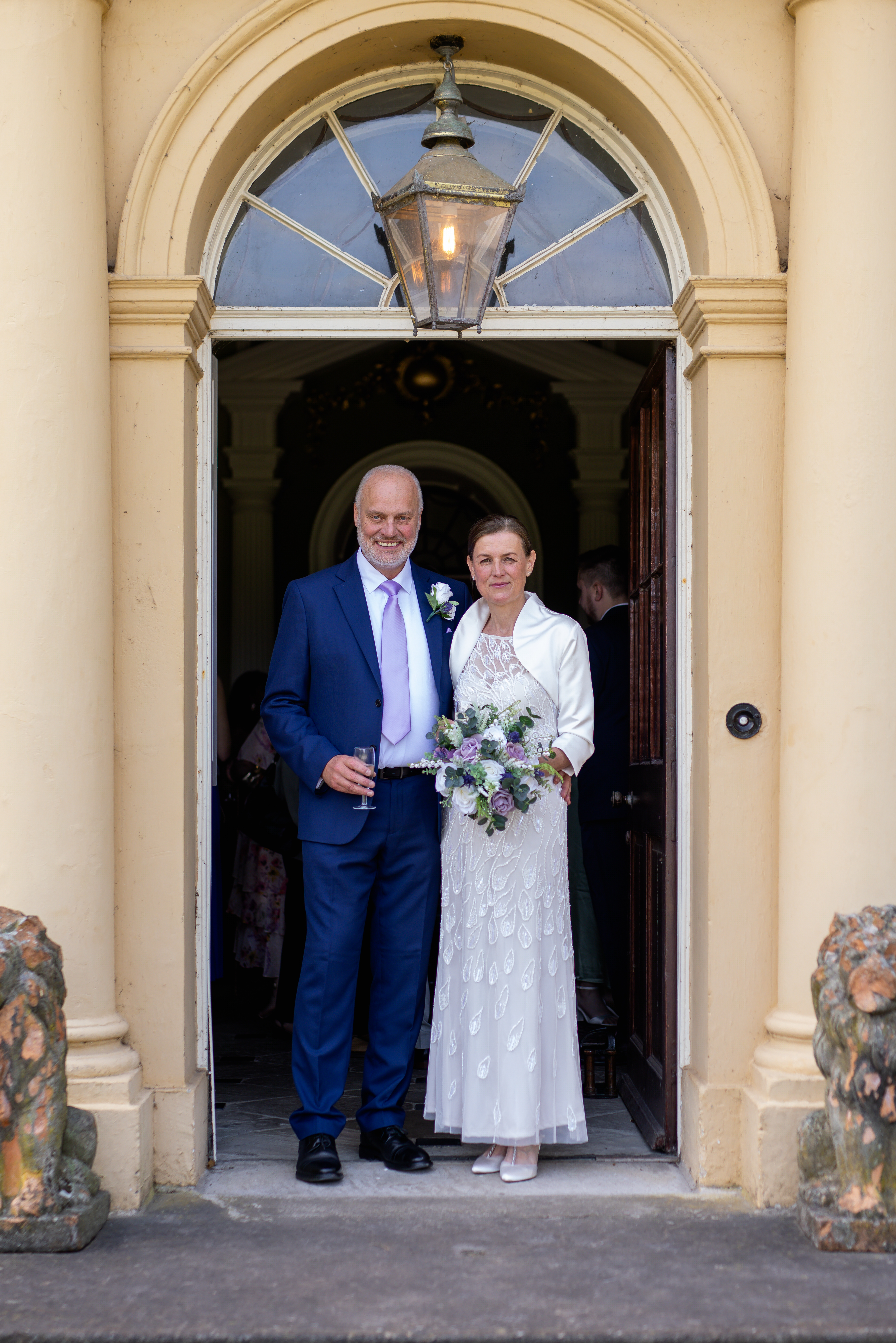 Helen and Michael pose for a photo in front of lytham Hall