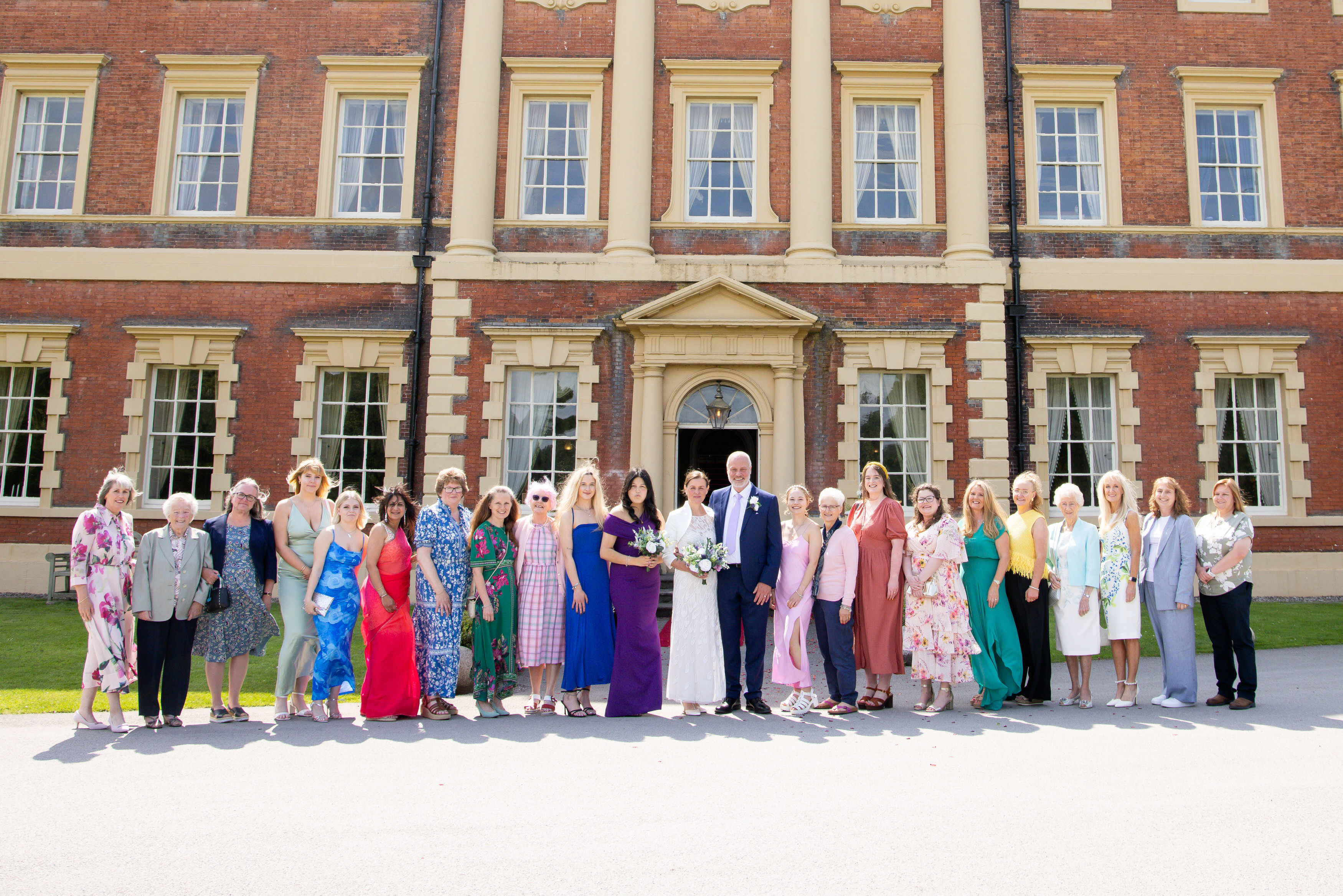 The bride and groom with all the ladies at the wedding 