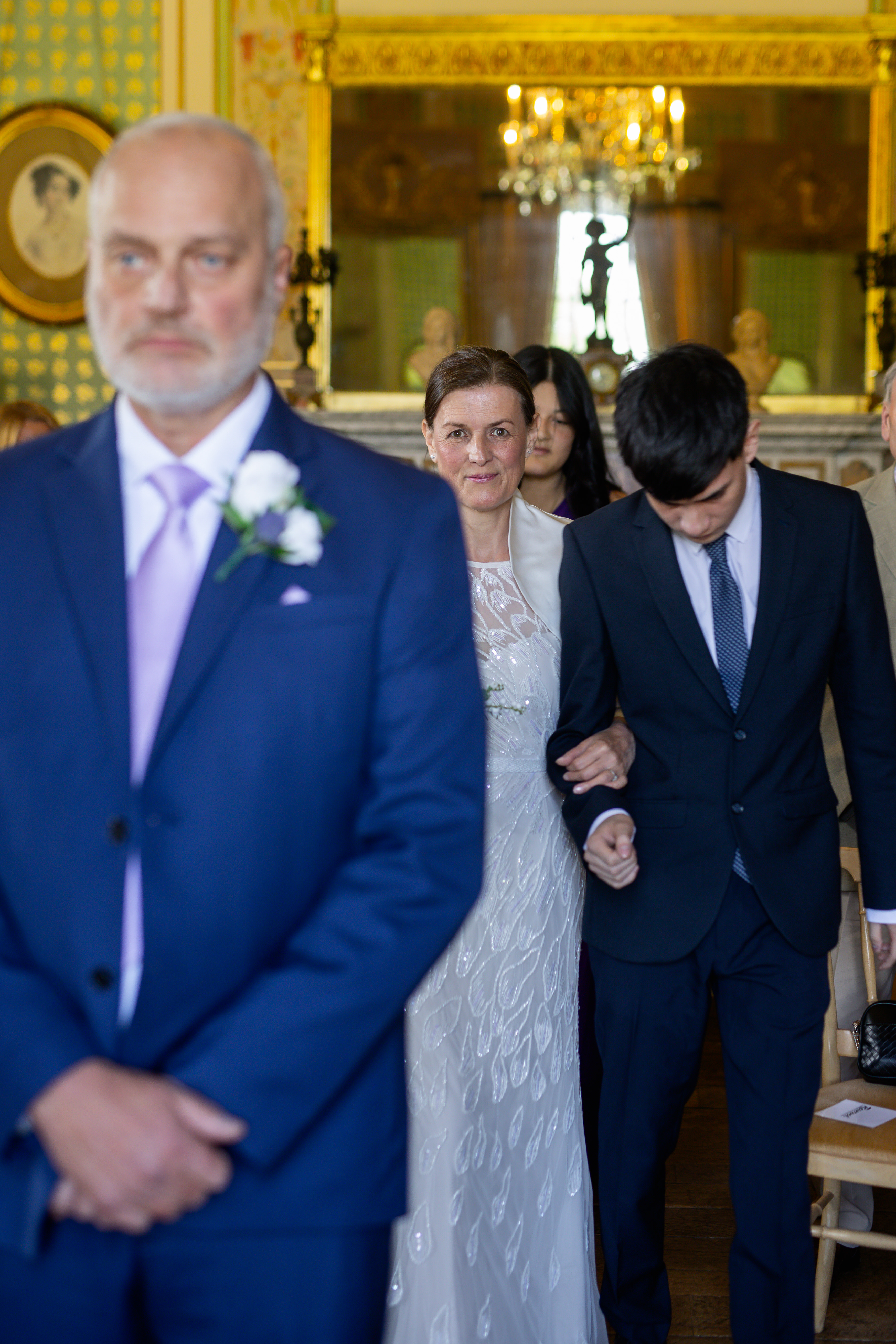 Helen walks in to the ceremony room with her son and daughter 