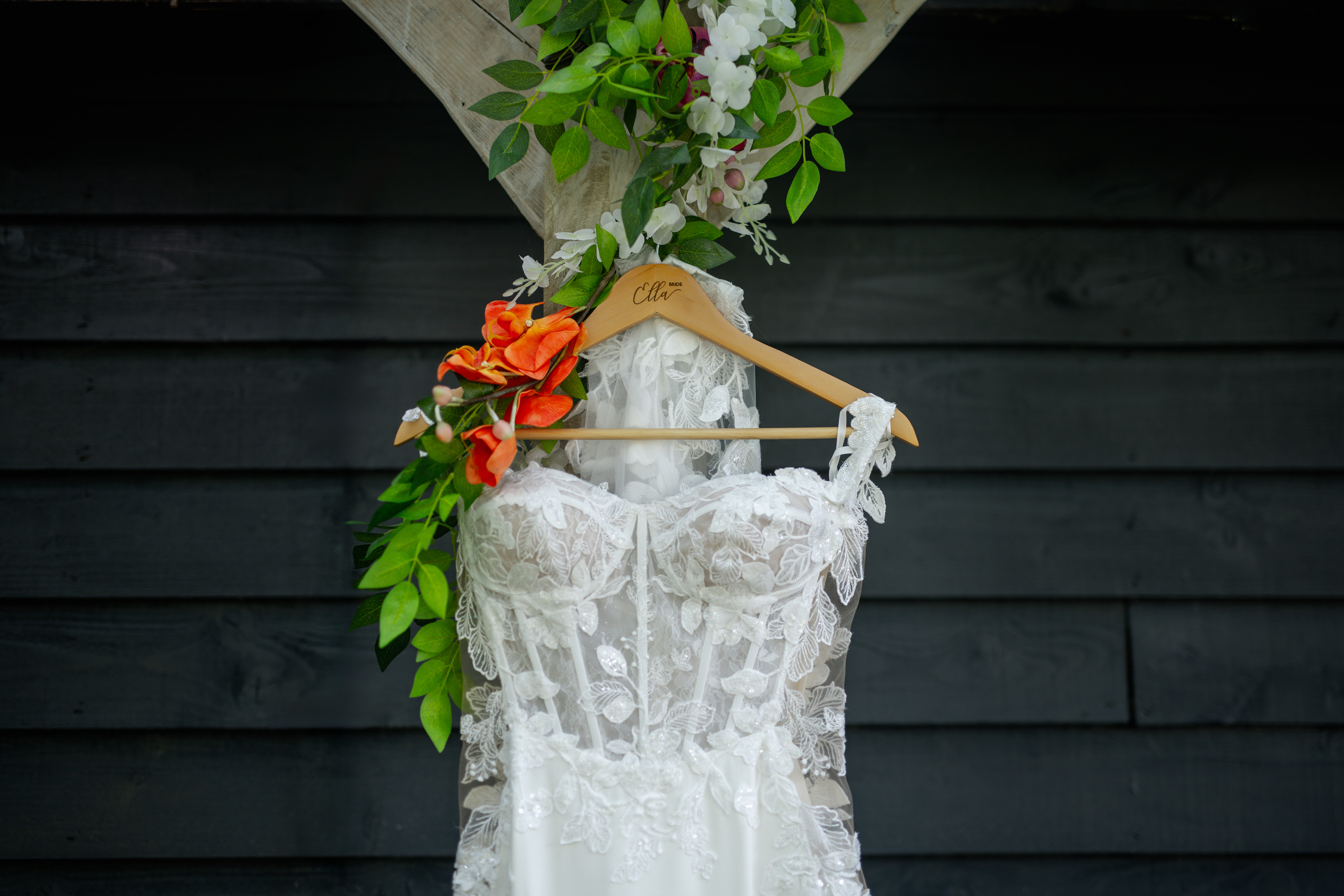 The bride's wedding dress hanging up 