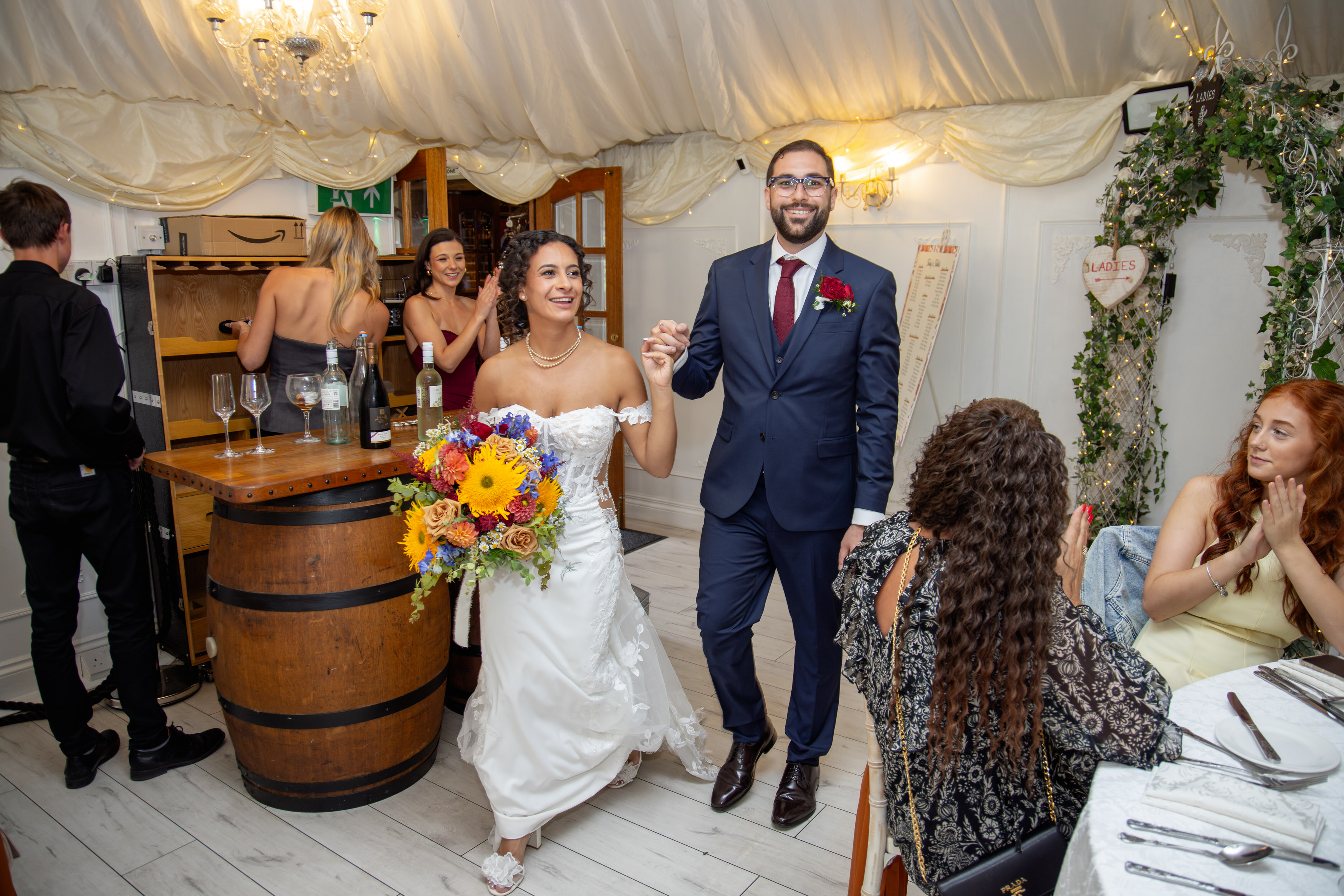 The Bide and groom enter the wedding reception