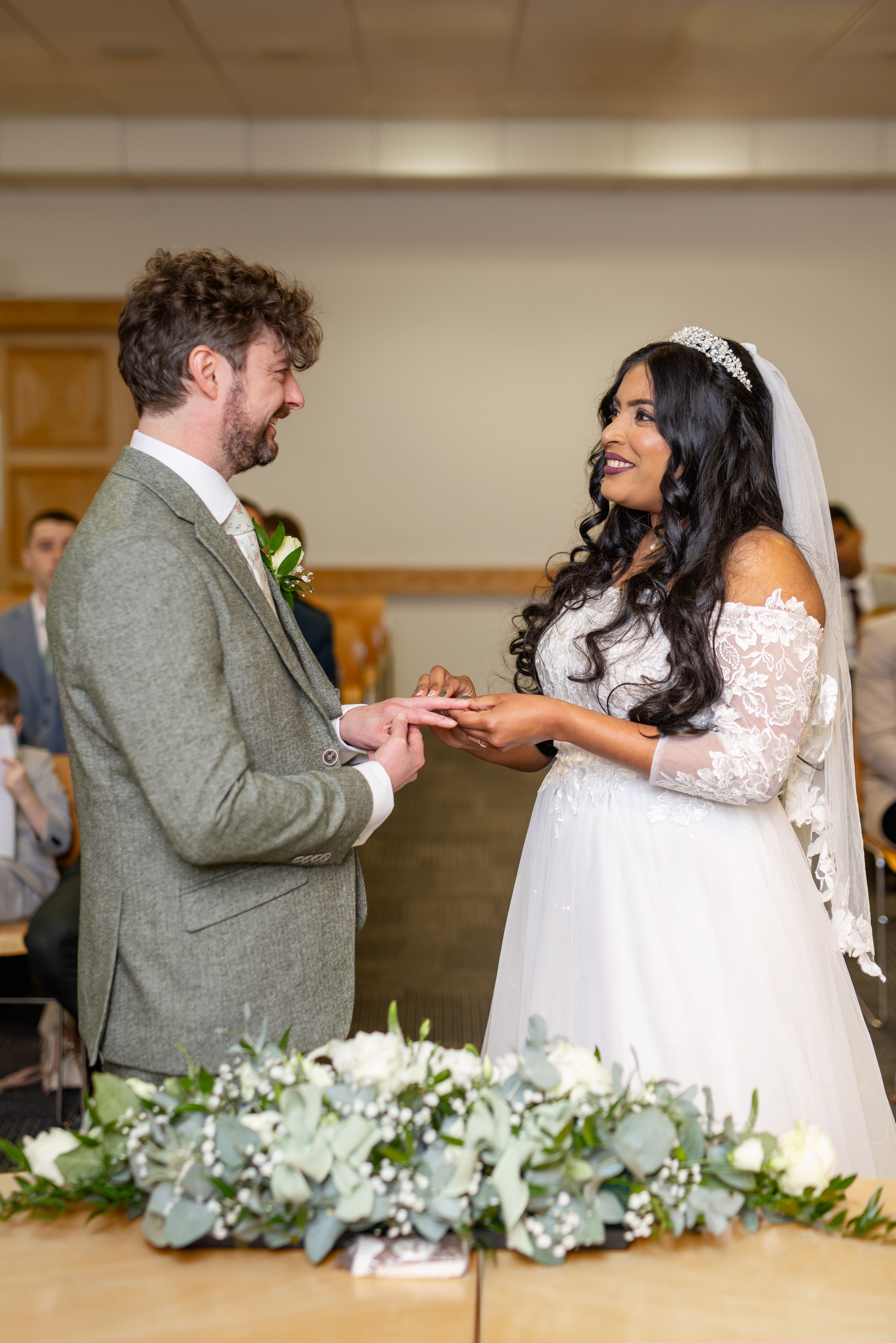 Udara puts Tony's wedding ring on his finger 