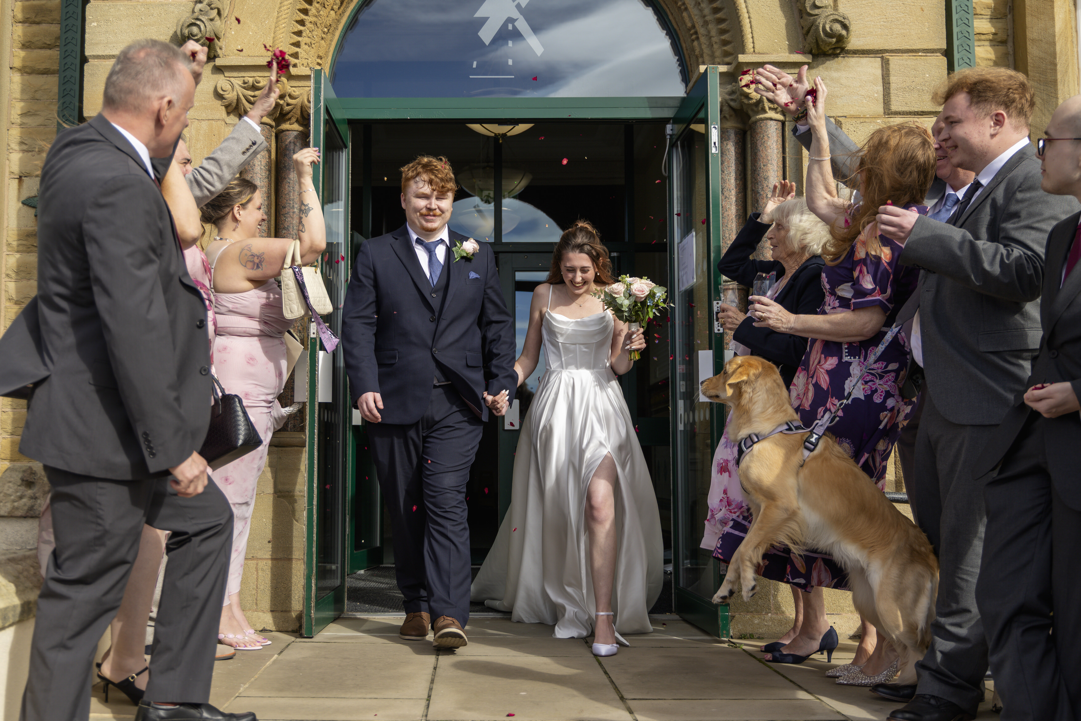 Ben and Katie make their way outside for the throwing of the confetti 