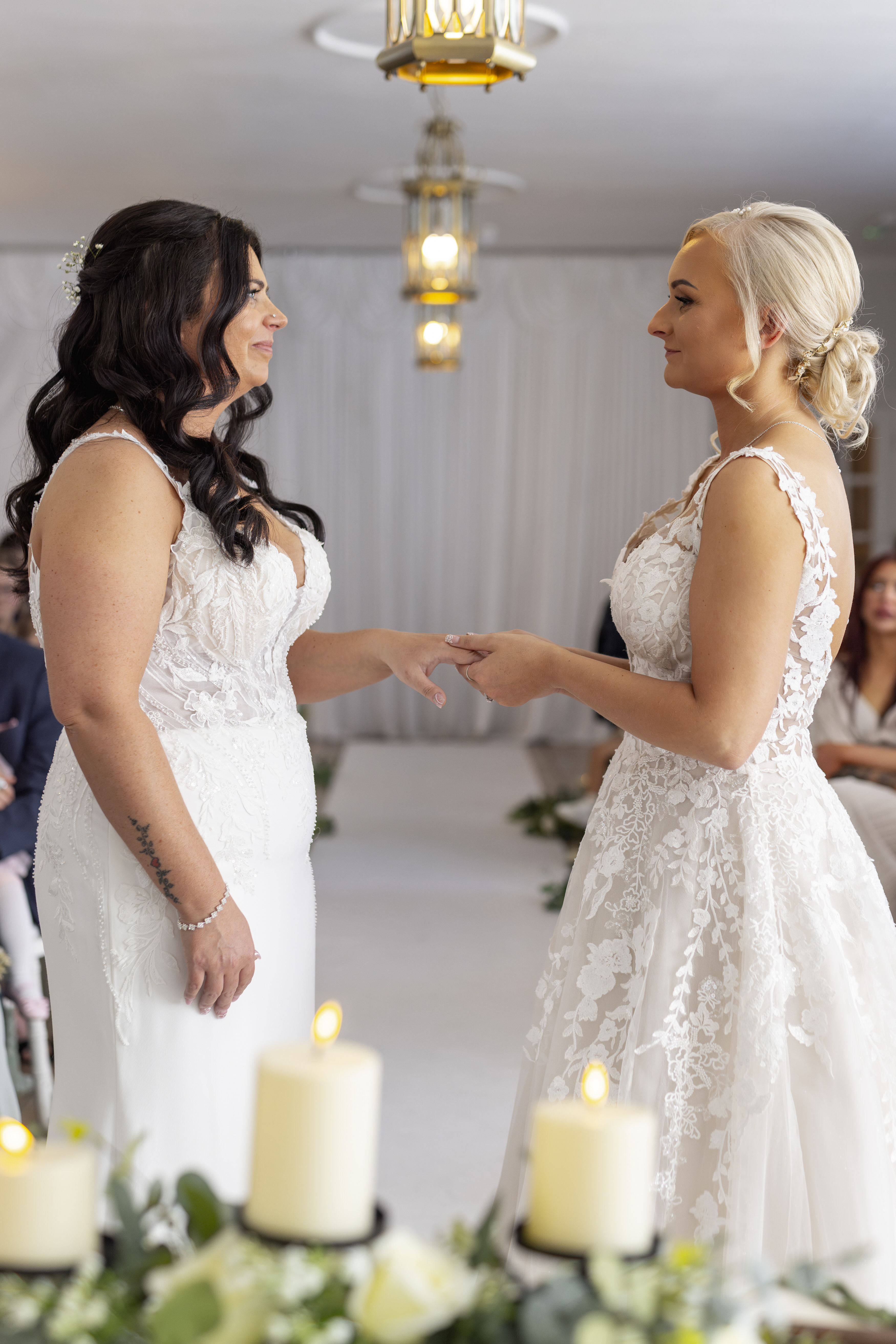 The bride and bride exchange wedding rings 